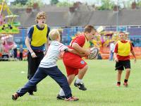 Young boys play a game of touch rugby