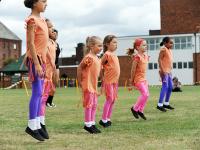 Young girls perfom a dance routine