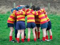 A rugby team in a huddle