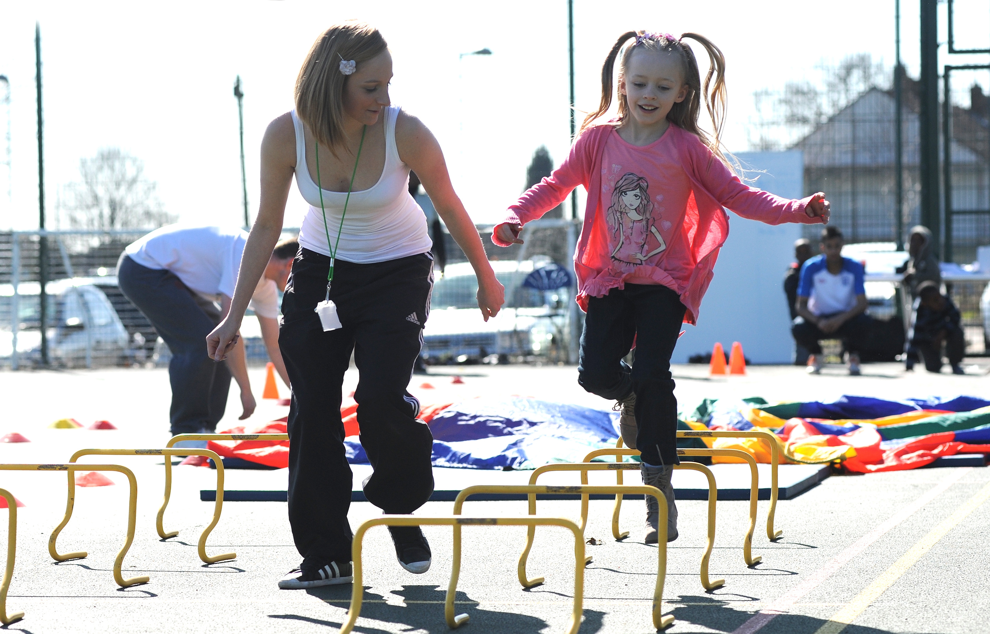 Little girl hurdling